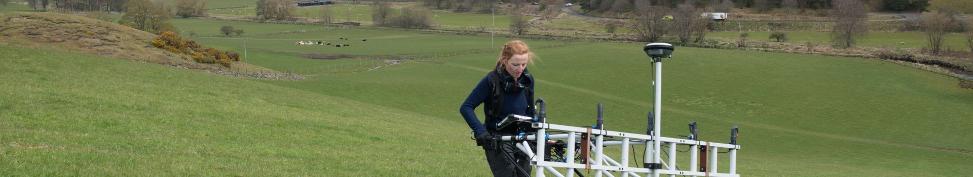 Person doing geophysical survey in field