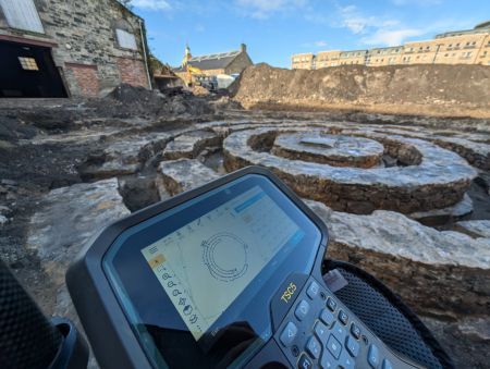 Photo of a 19th century gasholder, Trimble in foreground