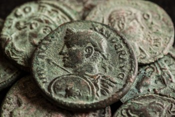 A selection of grey/green coloured Roman coins.